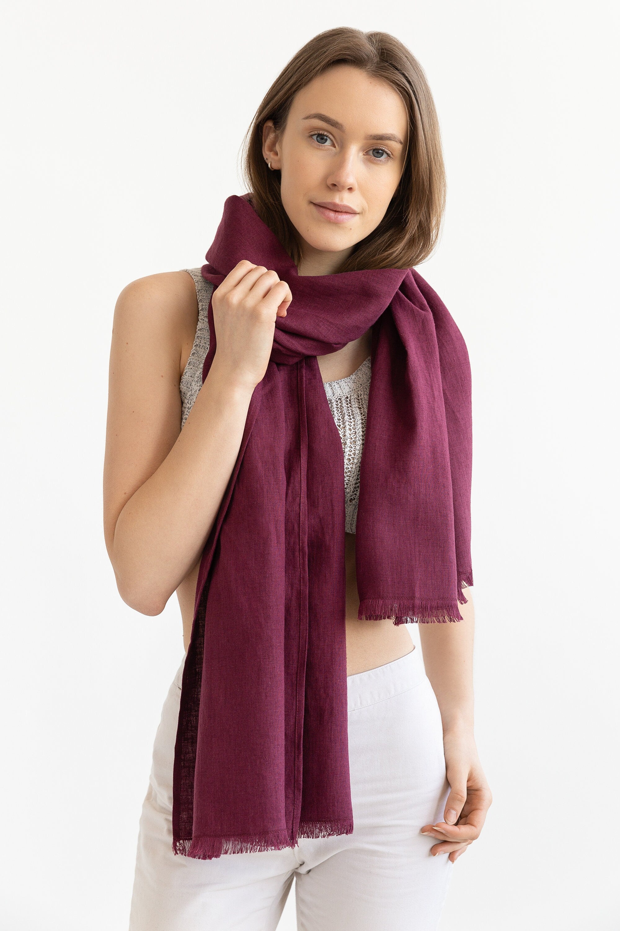 A stylish Dark Plum linen scarf made from 100% stonewashed linen, showcasing its soft texture and vibrant color.