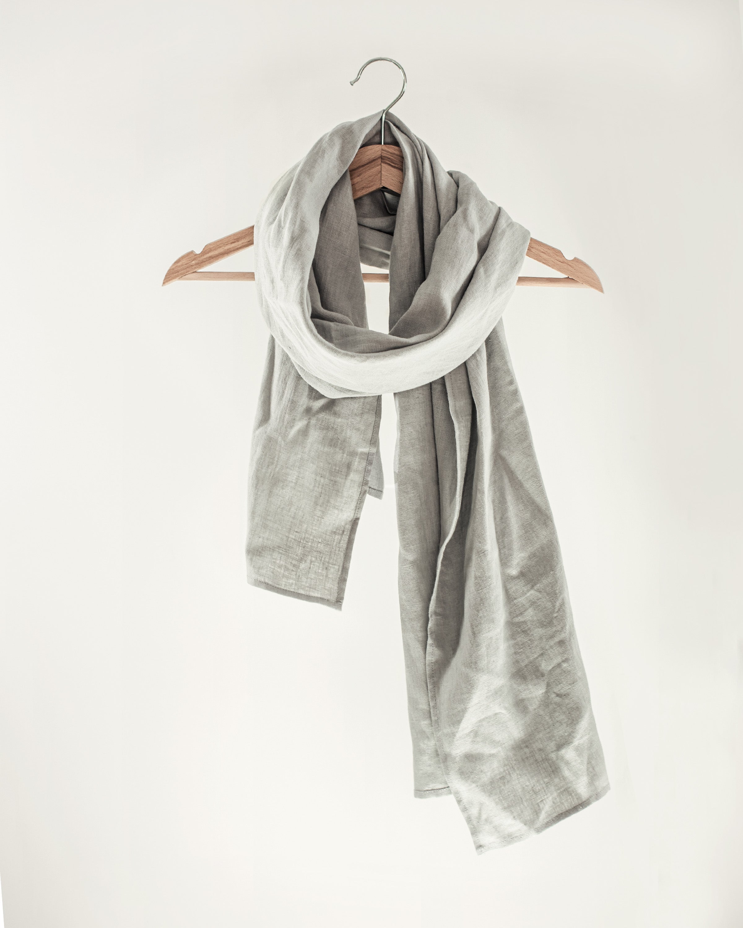 A stylish Dark Plum linen scarf made from 100% stonewashed linen, showcasing its lightweight and soft texture.