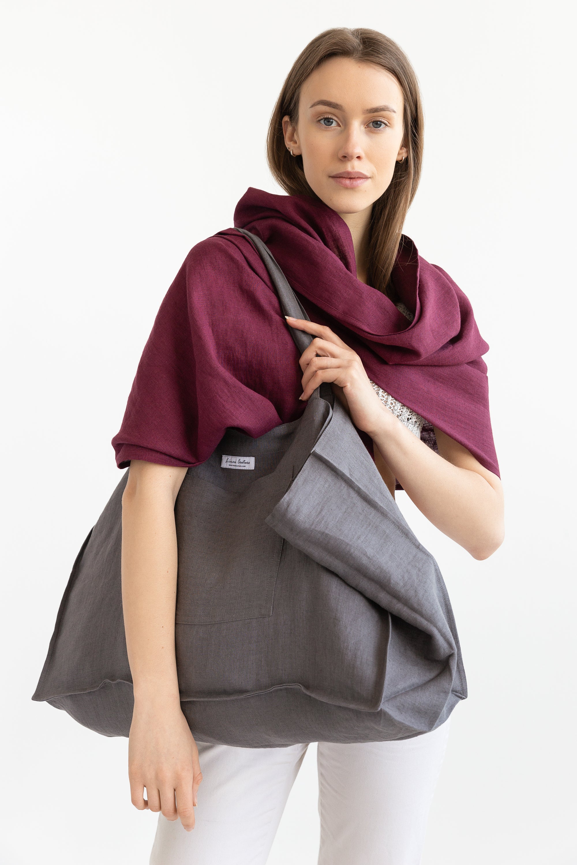 A stylish Dark Plum linen scarf made from 100% stonewashed linen, showcasing its lightweight and soft texture.