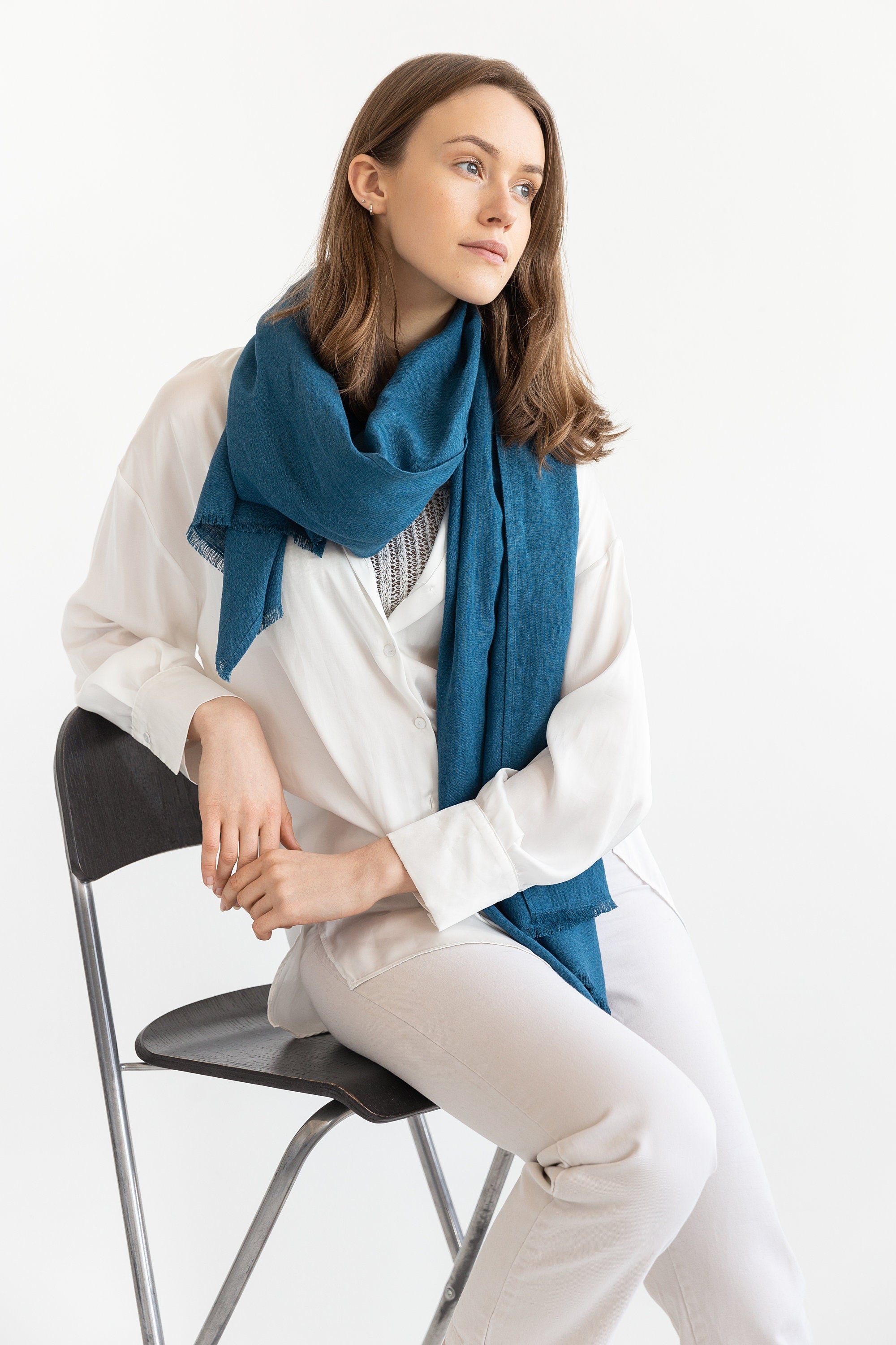 A stylish Dark Sea Blue scarf made from 100% stonewashed linen, showcasing its soft texture and elegant design.