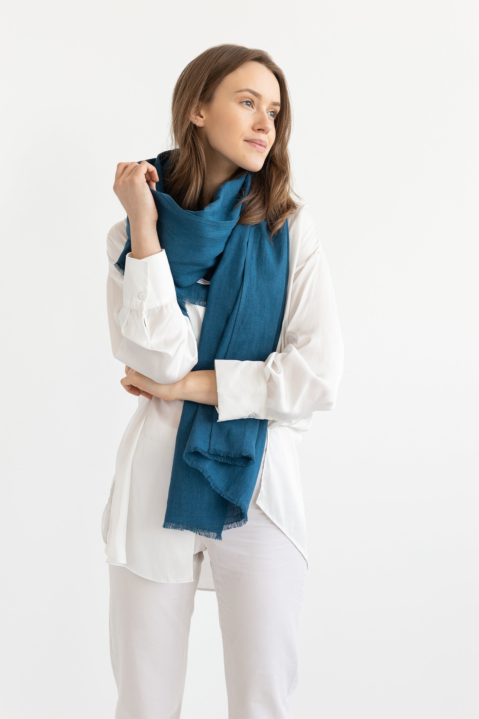 A stylish Dark Sea Blue scarf made from 100% stonewashed linen, showcasing its soft texture and elegant design.