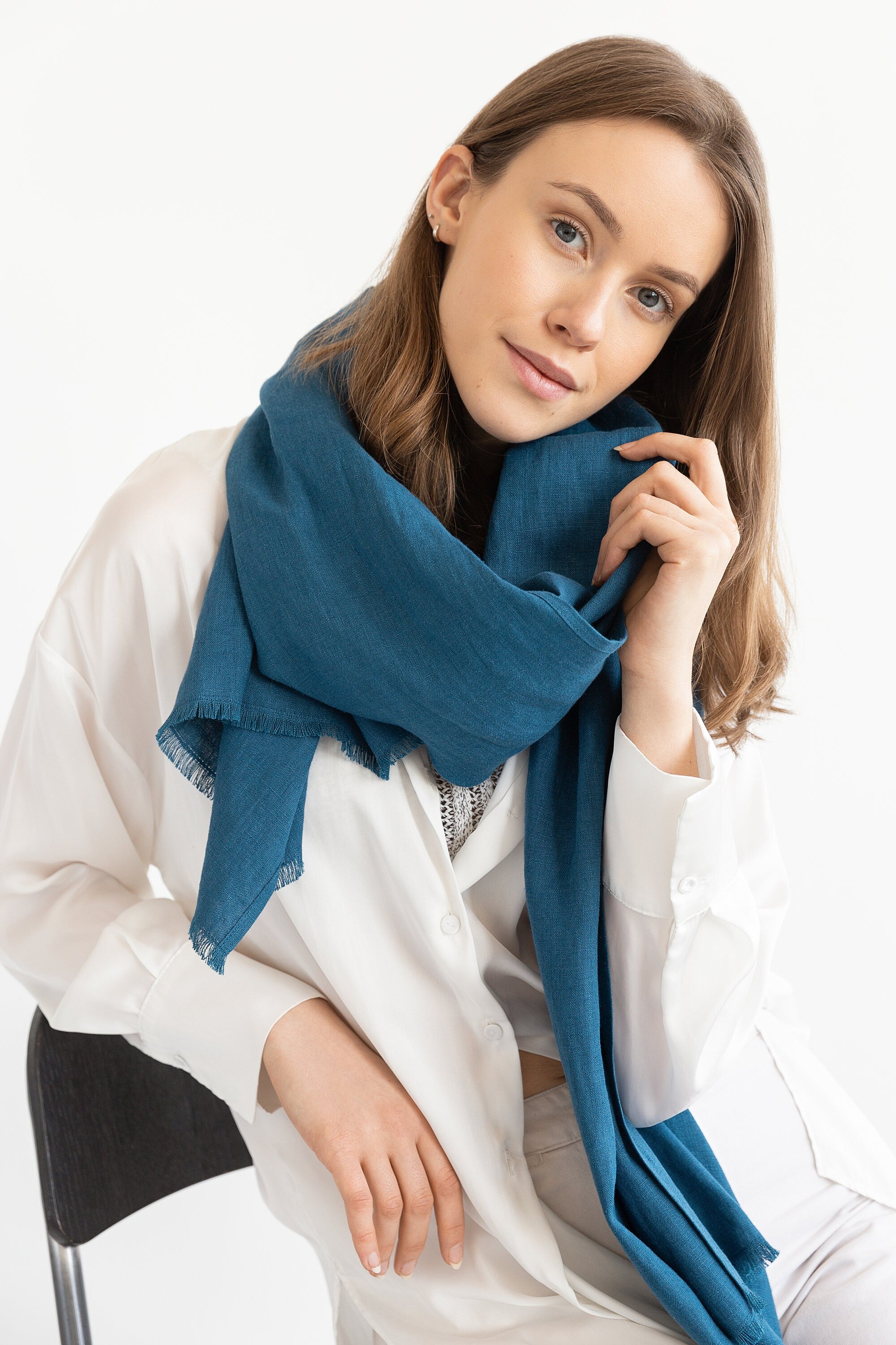 A stylish Dark Sea Blue scarf made from 100% stonewashed linen, showcasing its soft texture and elegant design.