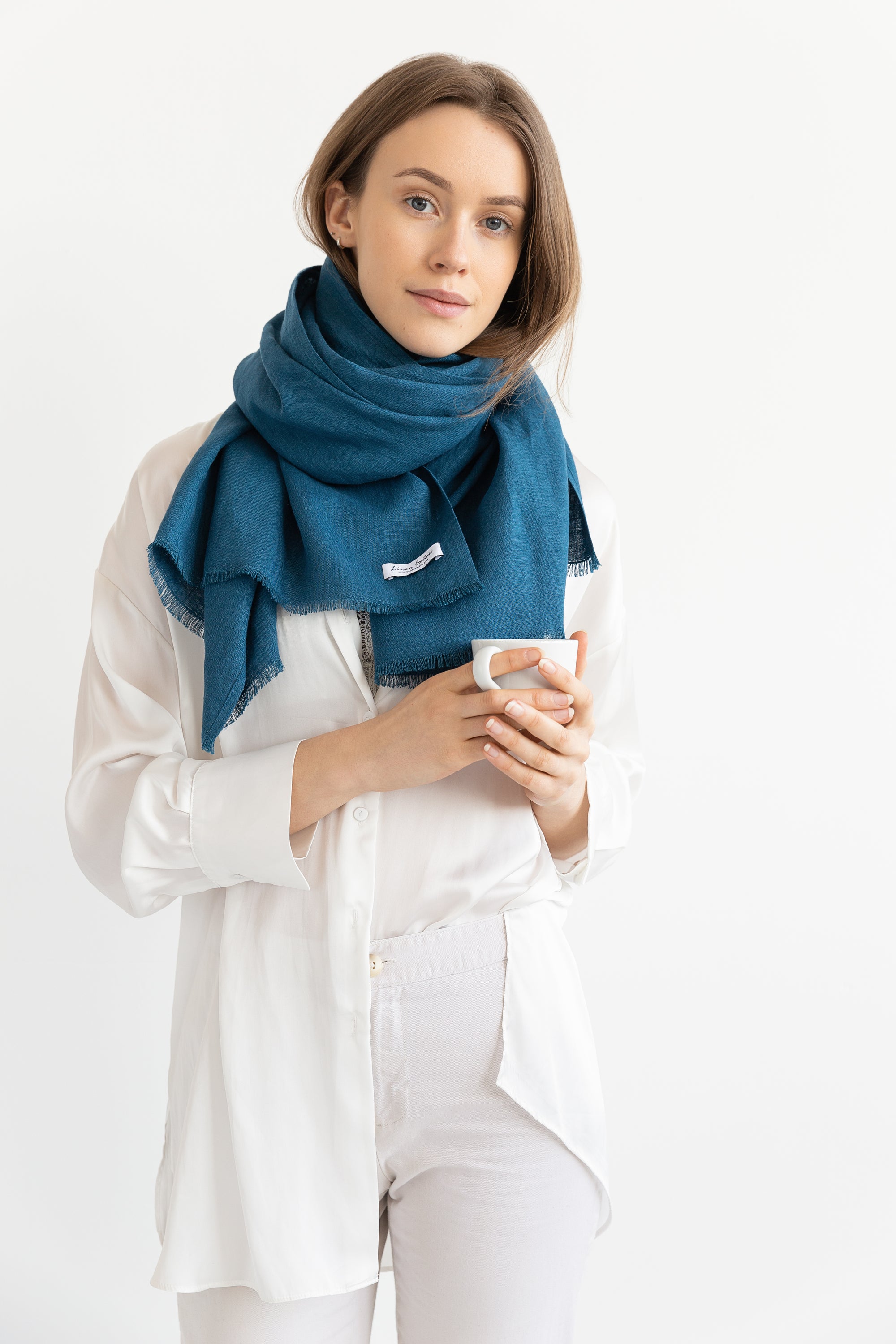 A stylish Dark Sea Blue scarf made from 100% stonewashed linen, showcasing its soft texture and elegant design.