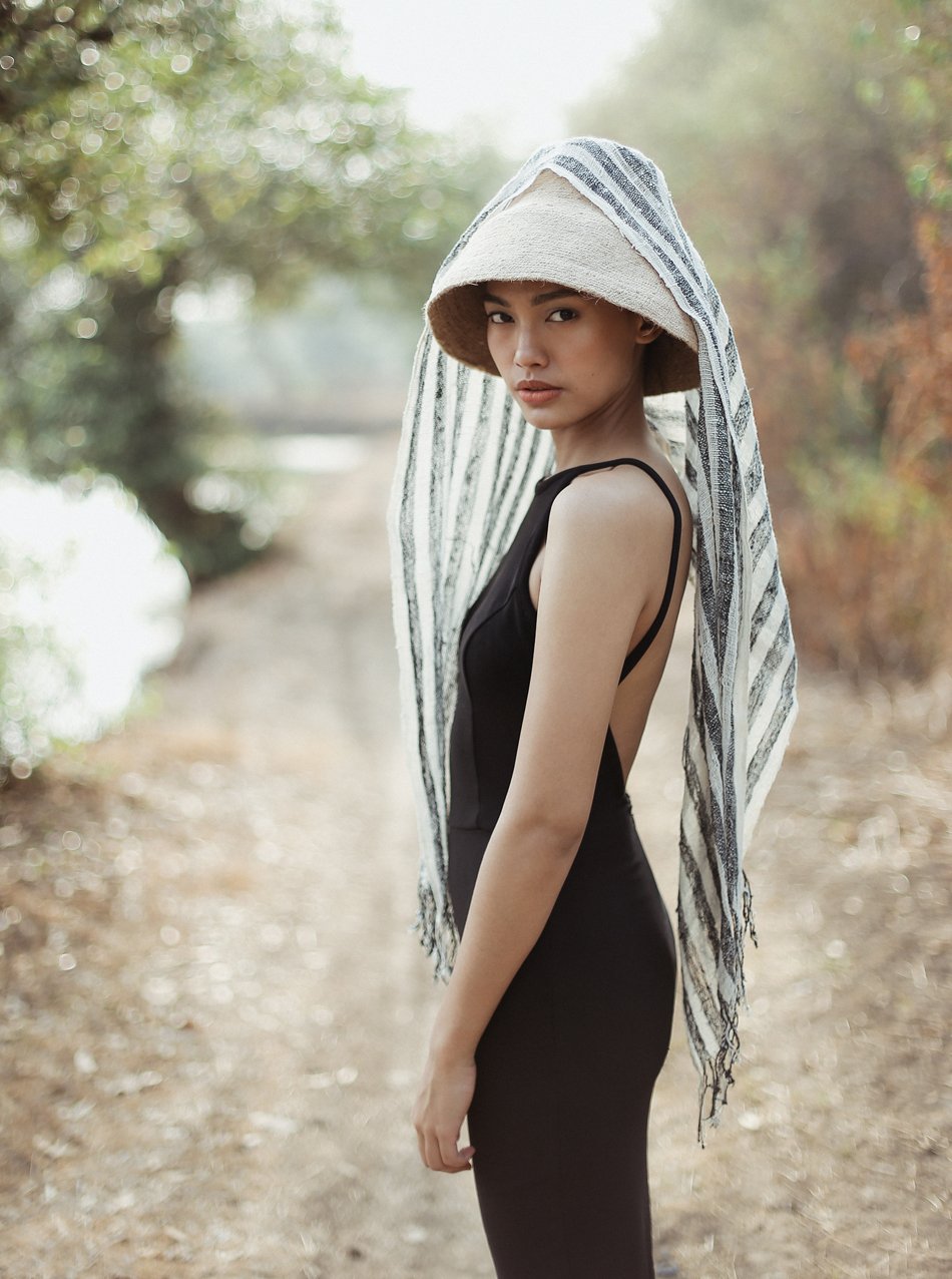 Fatima Hand-loomed Raw Cotton Scarf in Black with striped texture and fringe knots, showcasing artisanal craftsmanship.