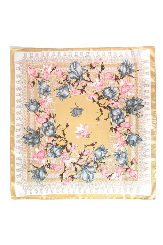 A vibrant floral printed silky square scarf, measuring 27.5 inches, showcasing a colorful design on a soft polyester fabric.