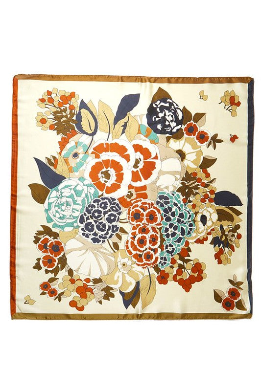 A vibrant flower printed silky square scarf, measuring 27.5 inches, showcasing a colorful floral design on soft polyester fabric.