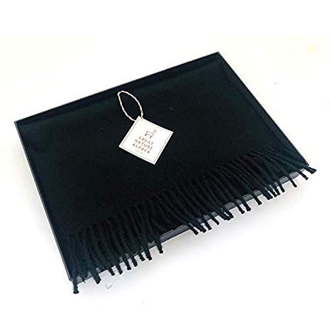 Luxurious black scarf made from 100% baby alpaca wool, showcasing its soft texture and elegant design.