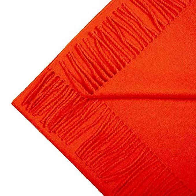 Luxurious orange scarf made from 100% baby alpaca wool, showcasing its soft texture and elegant design.