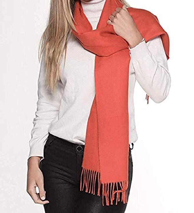 Luxurious orange scarf made from 100% baby alpaca wool, showcasing its soft texture and elegant design.