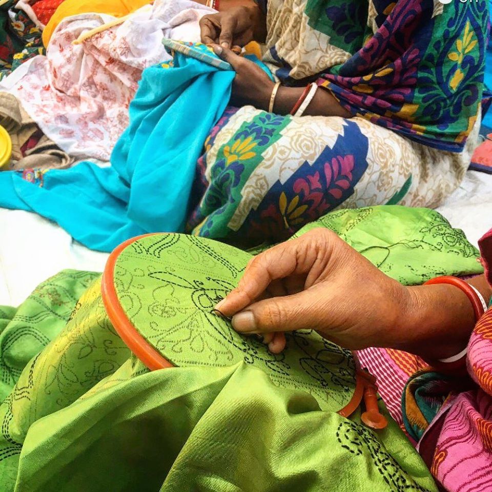 Hand embroidered Kantha silk shawl featuring vibrant floral motifs on a luxurious silk background, crafted by Kolkata artisans.