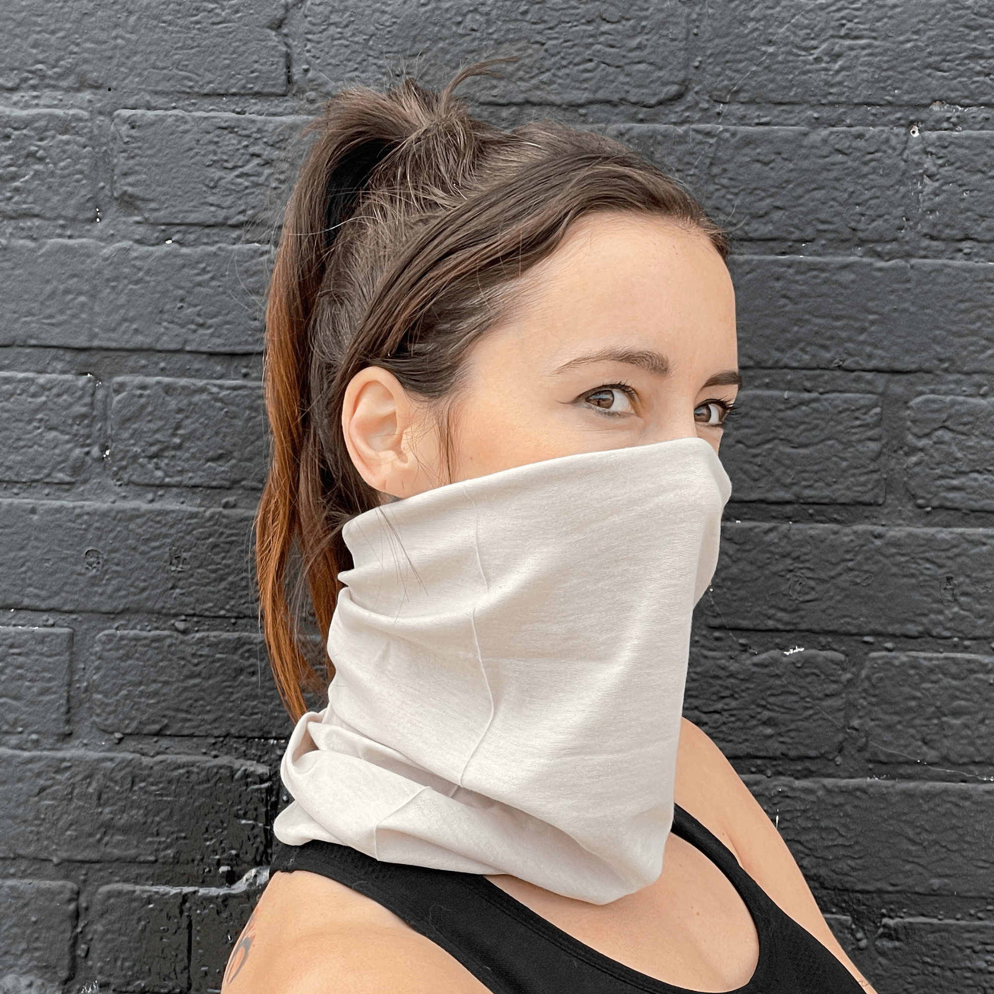 A stylish Hemless Neck Gaiter in various colors, designed for outdoor activities like hiking and cycling, showcasing its versatility and comfort.