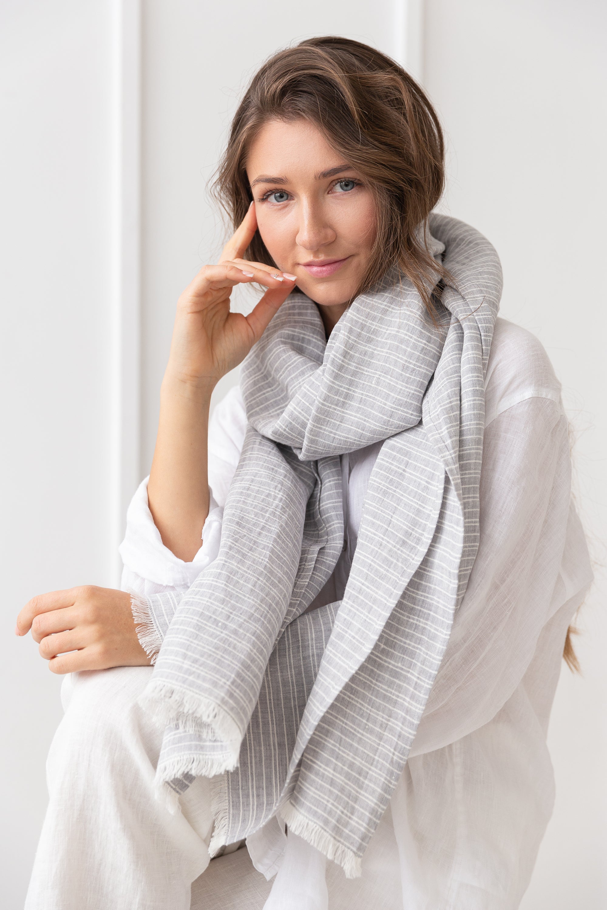 Elegant Ice Blue linen scarf made from 100% stonewashed linen, showcasing its soft texture and stylish design.