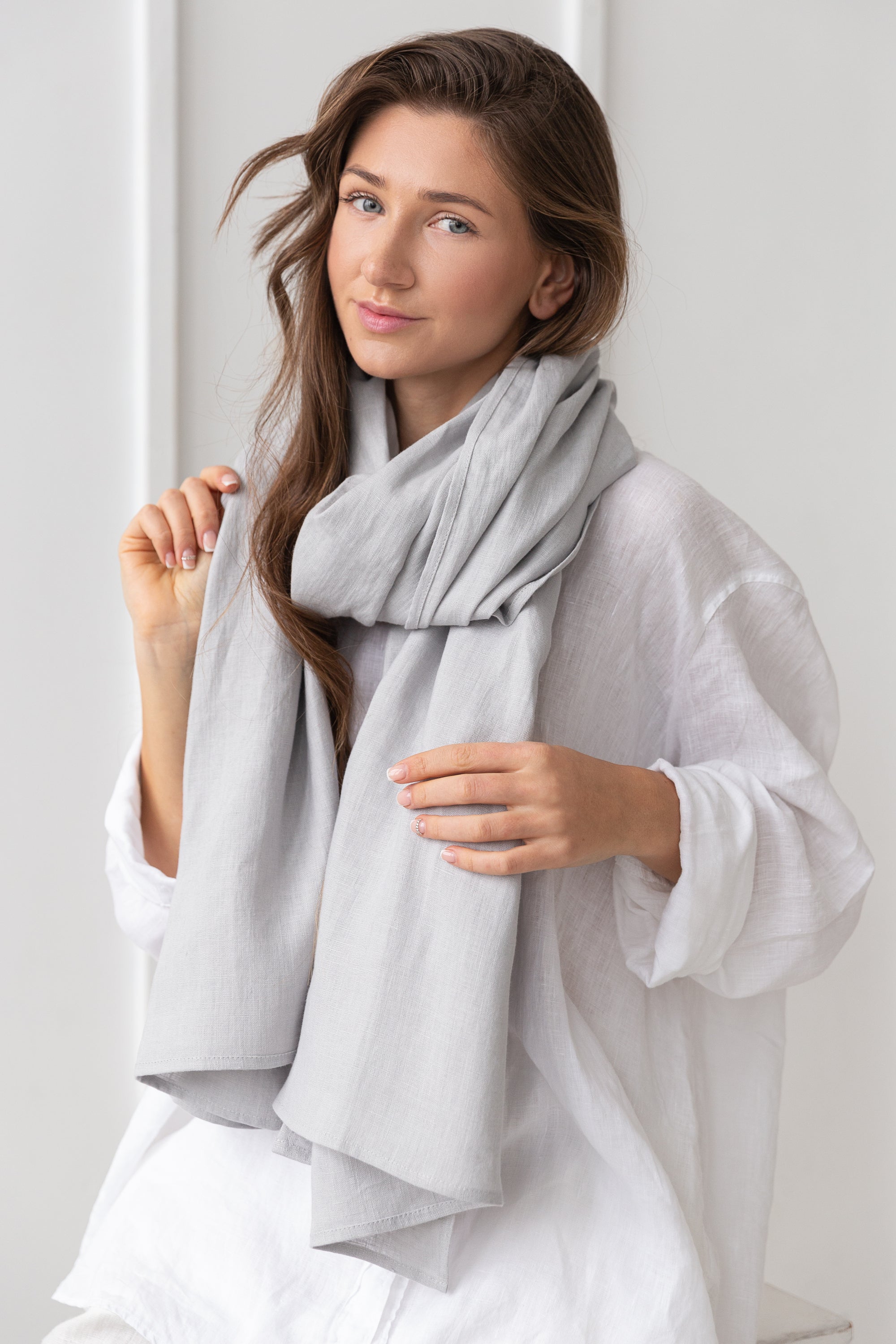 Elegant Ice Blue linen scarf made from 100% stonewashed linen, showcasing its soft texture and stylish design.