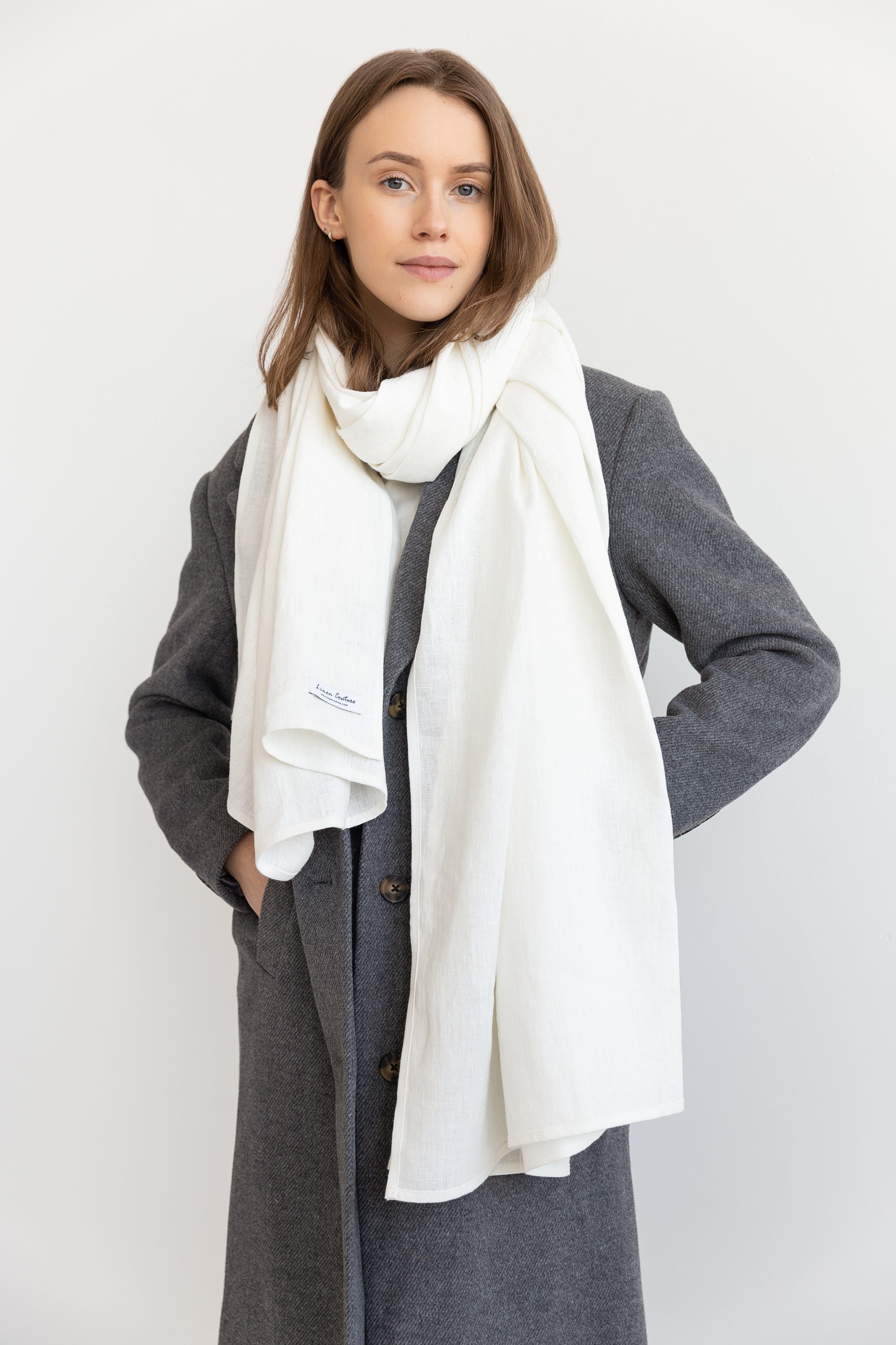 Elegant Ice Blue linen scarf made from 100% stonewashed linen, showcasing its soft texture and stylish design.