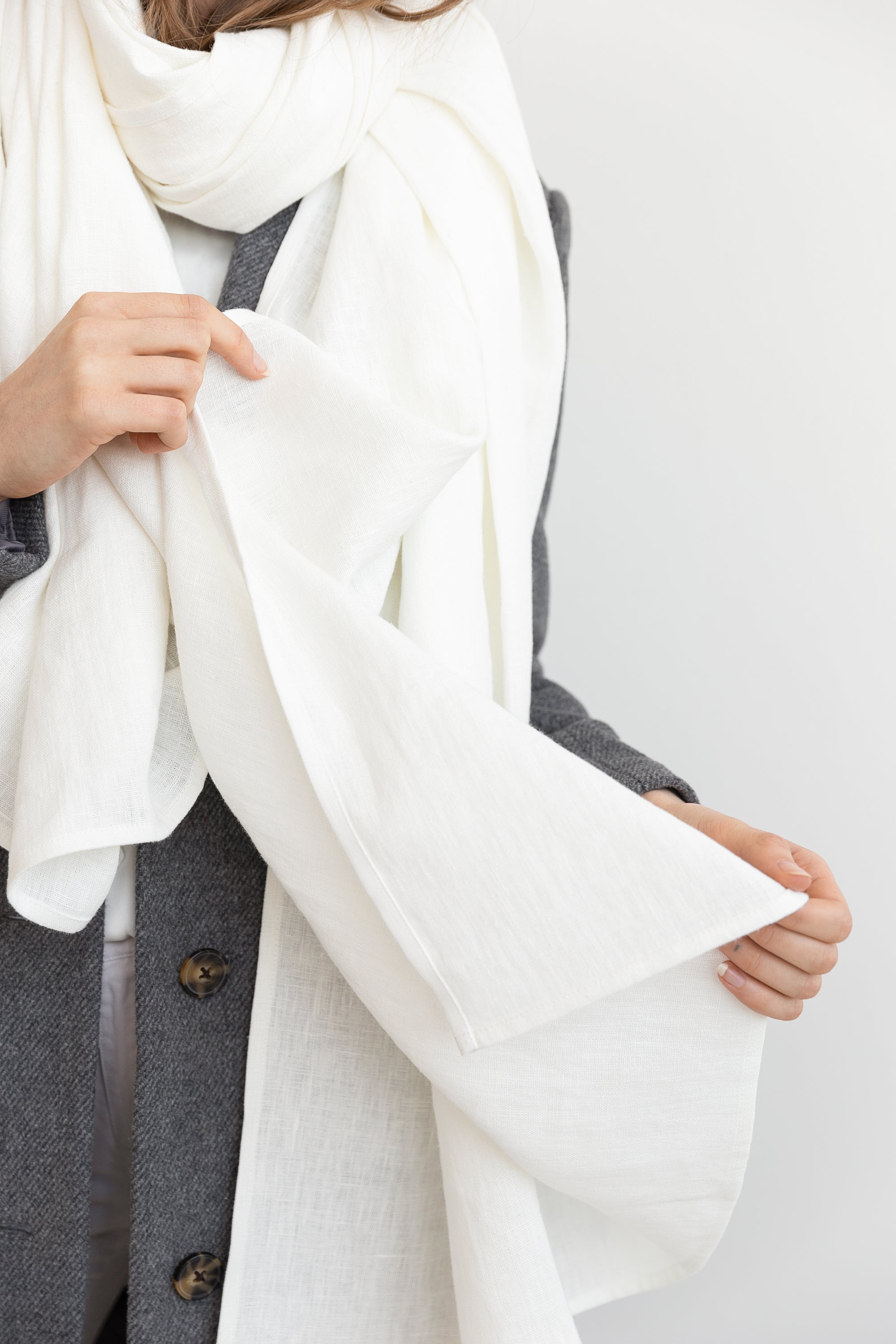 Elegant Ice Blue linen scarf made from 100% stonewashed linen, showcasing its soft texture and stylish design.