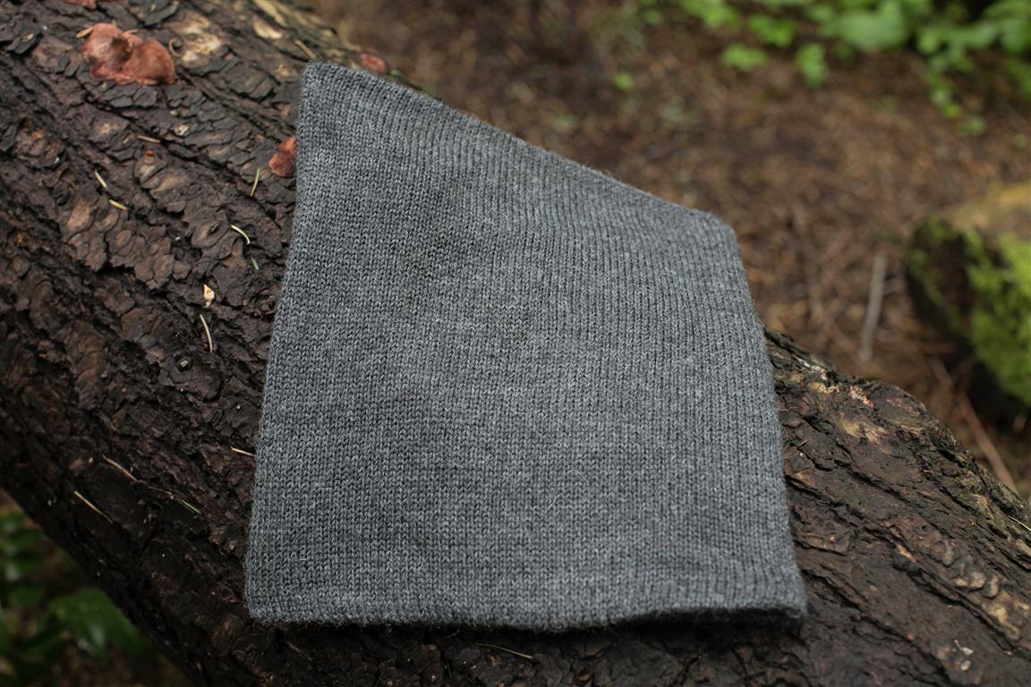 Iditarod Baby Alpaca Lined Neck Gator in black and grey, showcasing its soft fleece lining and stylish design, perfect for outdoor activities.