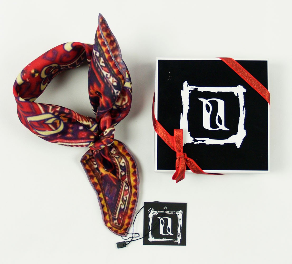 Khali Necktie Scarf featuring a vibrant Armenian carpet design in warm colors, made from 100% silk twill, elegantly folded in a gift box.