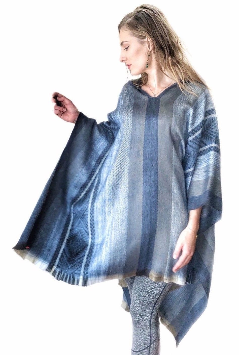 Light baby blue alpaca poncho with gray accents, featuring a cozy hood, perfect for stylish warmth.