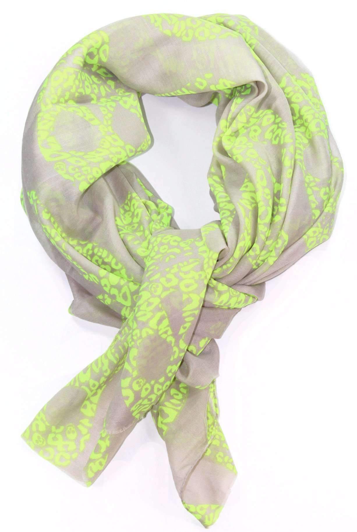 A vibrant lime green skull scarf with pastel brown background, showcasing a unique skull pattern.