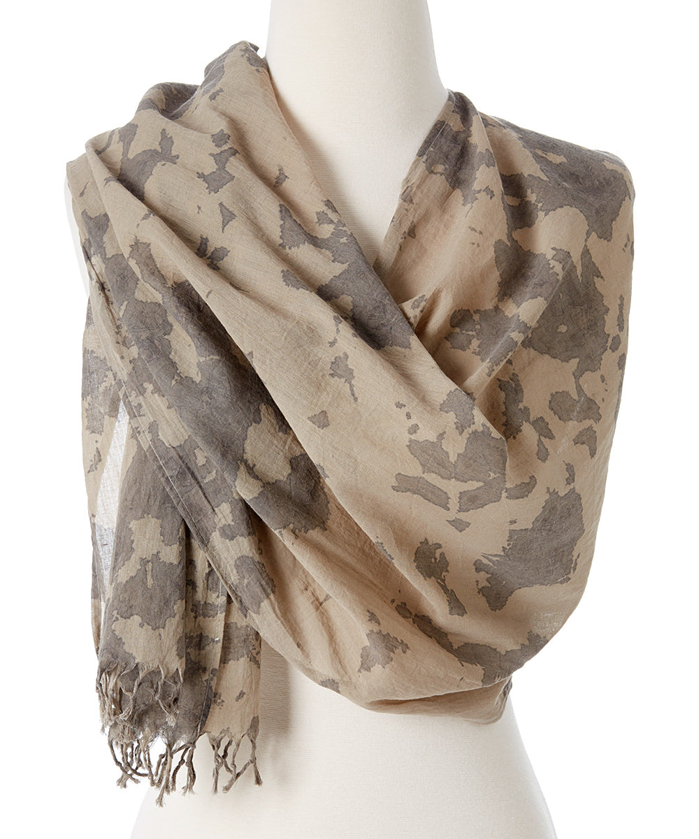 A vibrant Organic Tie Dye Scarf made from 100% organic cotton, showcasing beautiful hand-dyed patterns in natural colors.