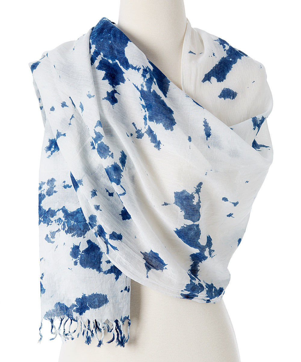 A vibrant Organic Tie Dye Scarf made from 100% organic cotton, showcasing beautiful hand-dyed patterns in natural colors.