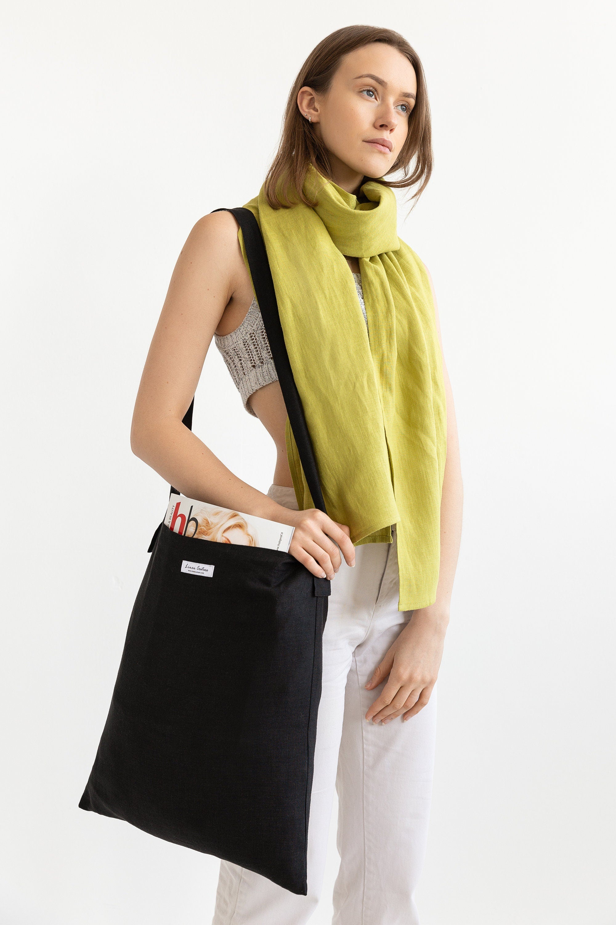 A bright Pear colored linen scarf made from 100% stonewashed linen, showcasing its soft texture and lightweight design.