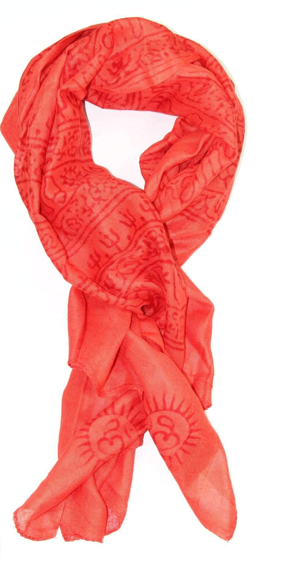 A luxurious red-orange scarf featuring intricate Sanskrit writing and Om symbols, made from 100% cotton.