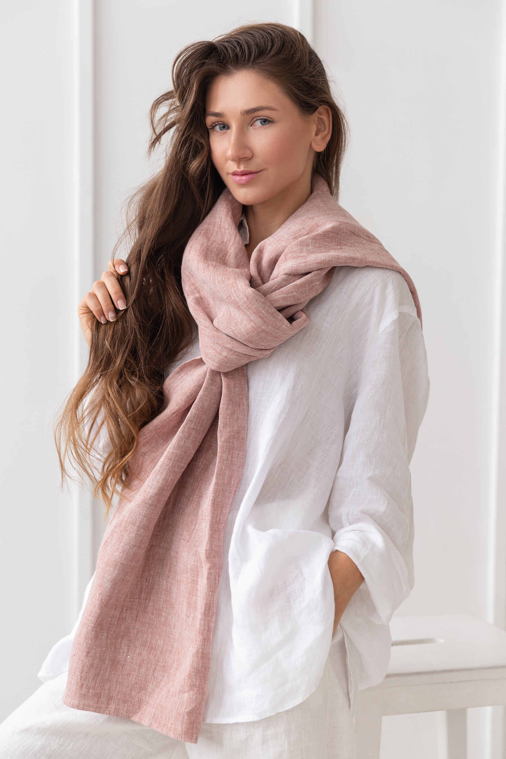 A stylish reddish brown linen scarf made from 100% stonewashed linen, showcasing its soft texture and elegant design.