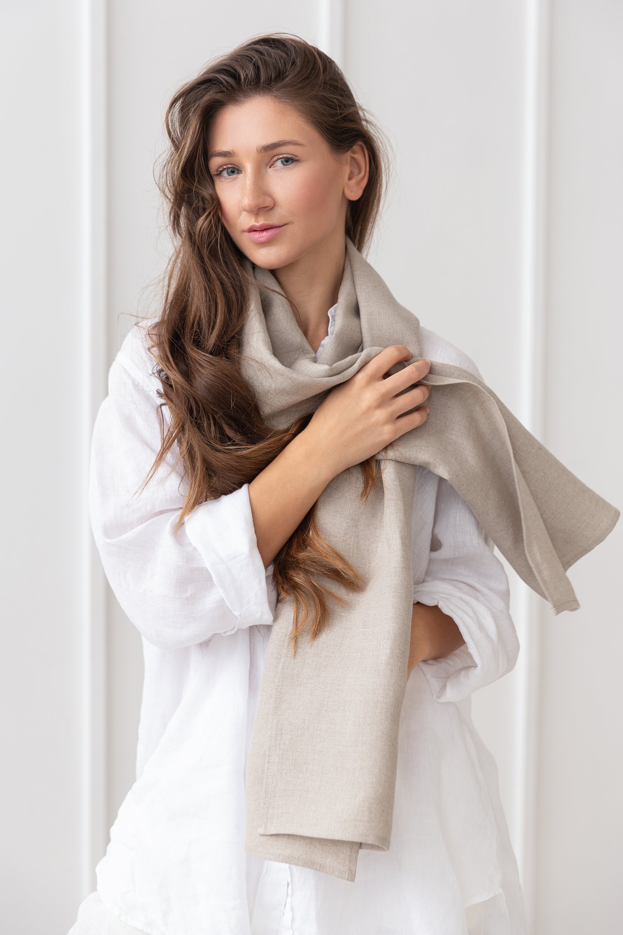 A stylish reddish brown linen scarf made from 100% stonewashed linen, showcasing its soft texture and elegant design.