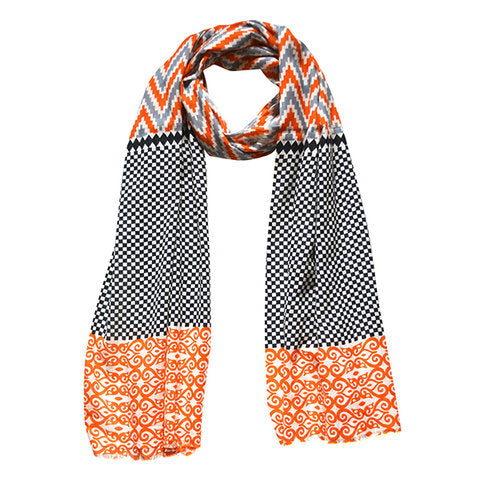 Sahara Ikat Print fashion scarf featuring vibrant geometric patterns in soft 100% viscose fabric, perfect for layering.