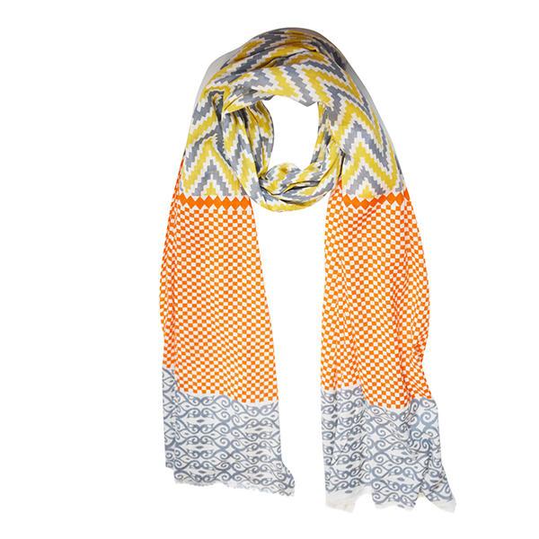 Sahara Ikat Print fashion scarf featuring vibrant geometric patterns in soft 100% viscose fabric, perfect for layering.