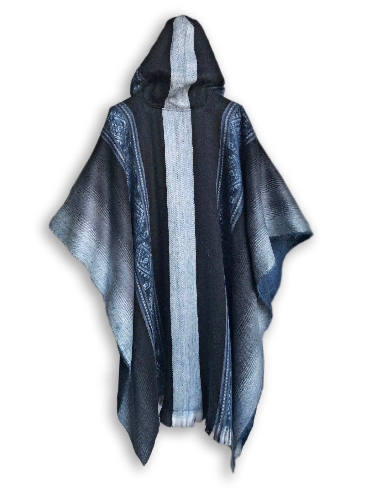 A soft blues and grays alpaca poncho draped elegantly, showcasing its calming colors and luxurious texture.