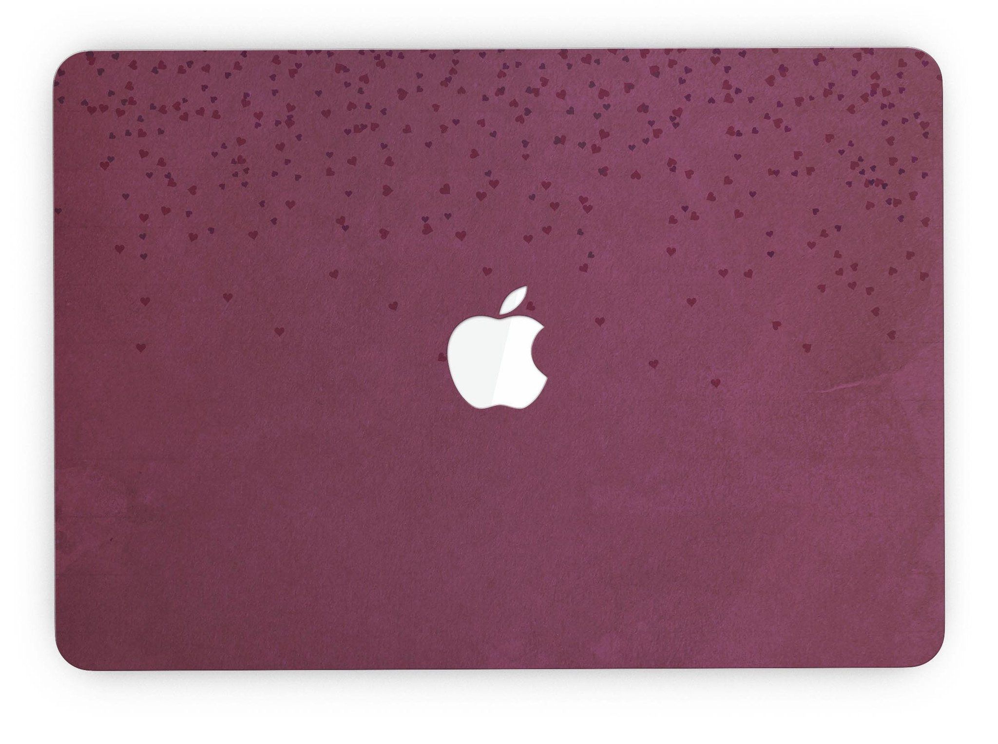 A MacBook Pro with Retina Display covered in a stylish 50 Shades of Burgundy Micro Hearts skin, showcasing intricate heart patterns.