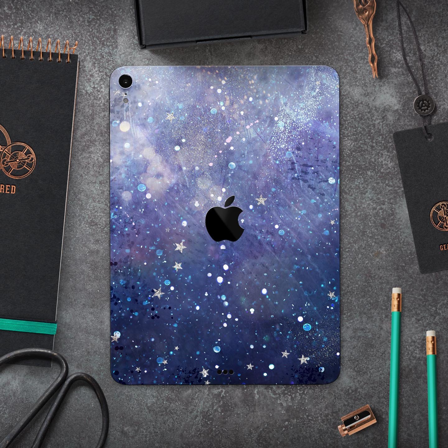 Abstract Blue Grungy Stars skin decal for Apple iPad, showcasing a vibrant star design on a protective layer.