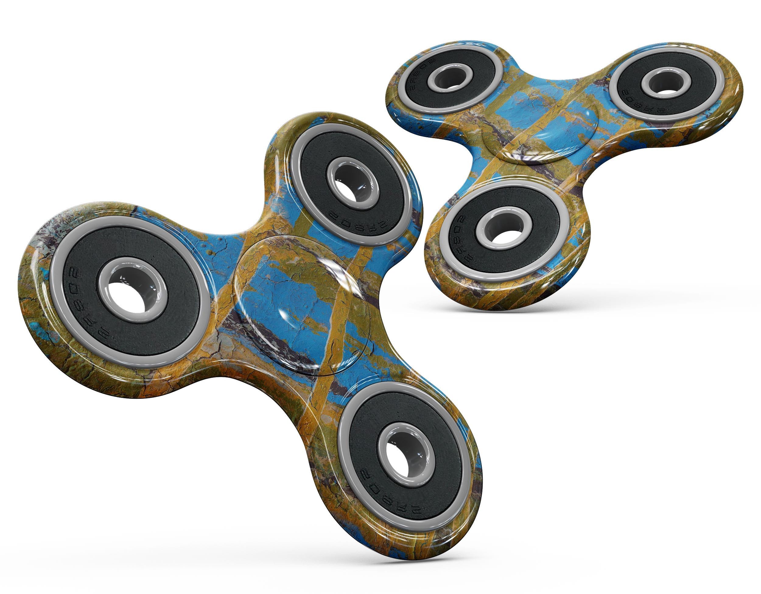 Abstract Gold and Teal Wet Paint Skin-Kit for fidget spinner, showcasing vibrant colors and unique design.