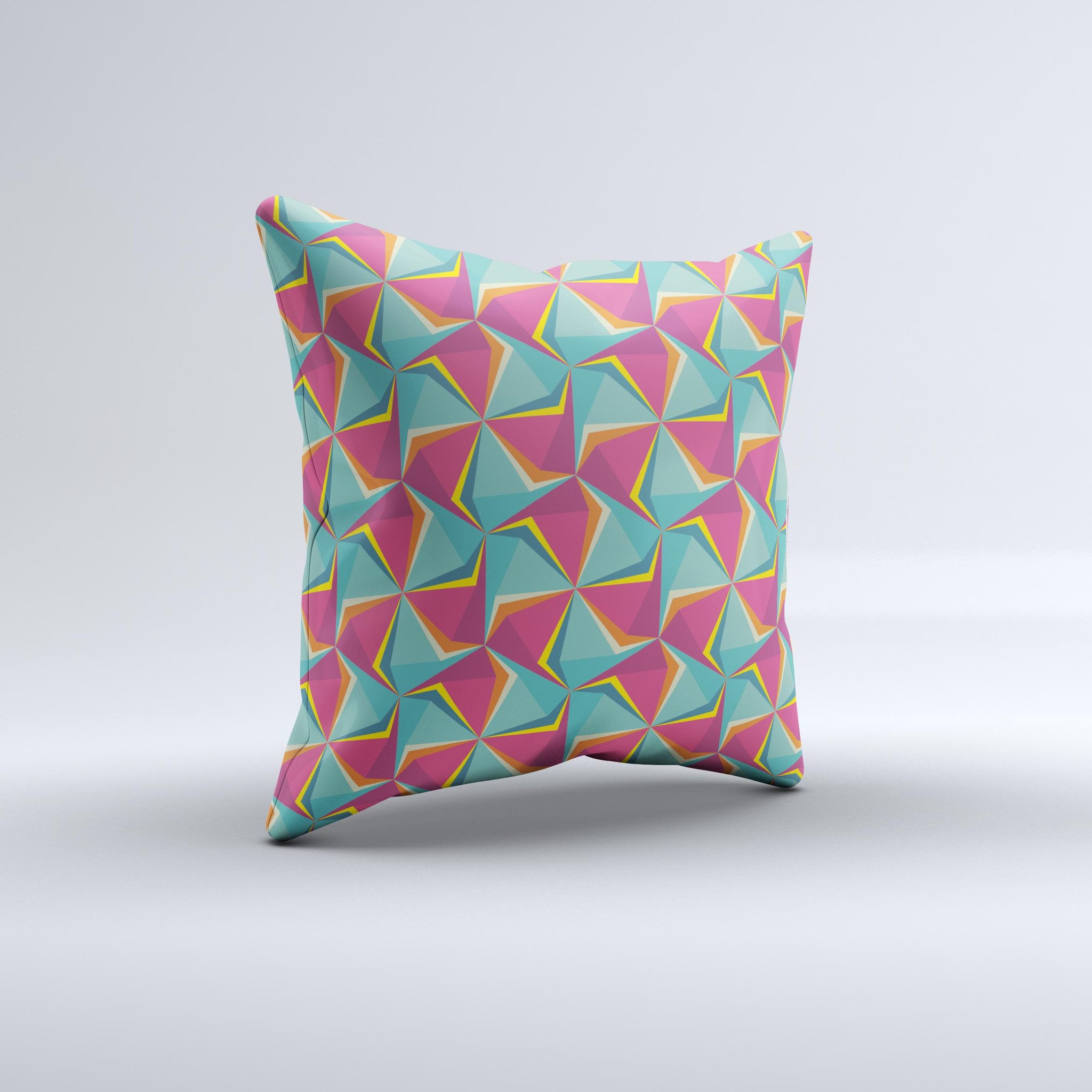 A vibrant decorative throw pillow featuring an abstract design of green and pink cubes, handcrafted in Virginia.