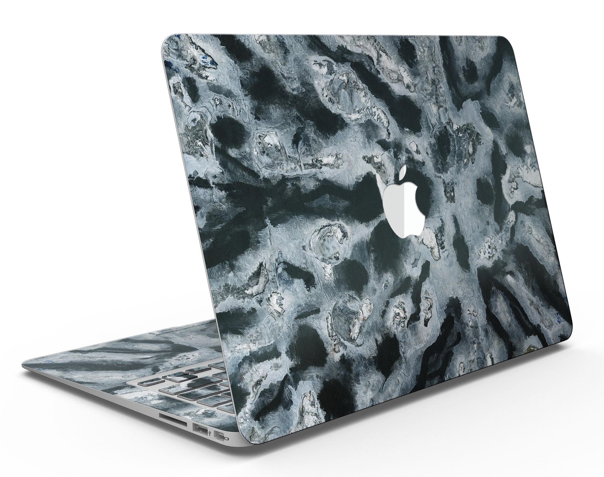 Abstract Paint v4 skin kit for MacBook Air, showcasing vibrant colors and unique design on a sleek device.