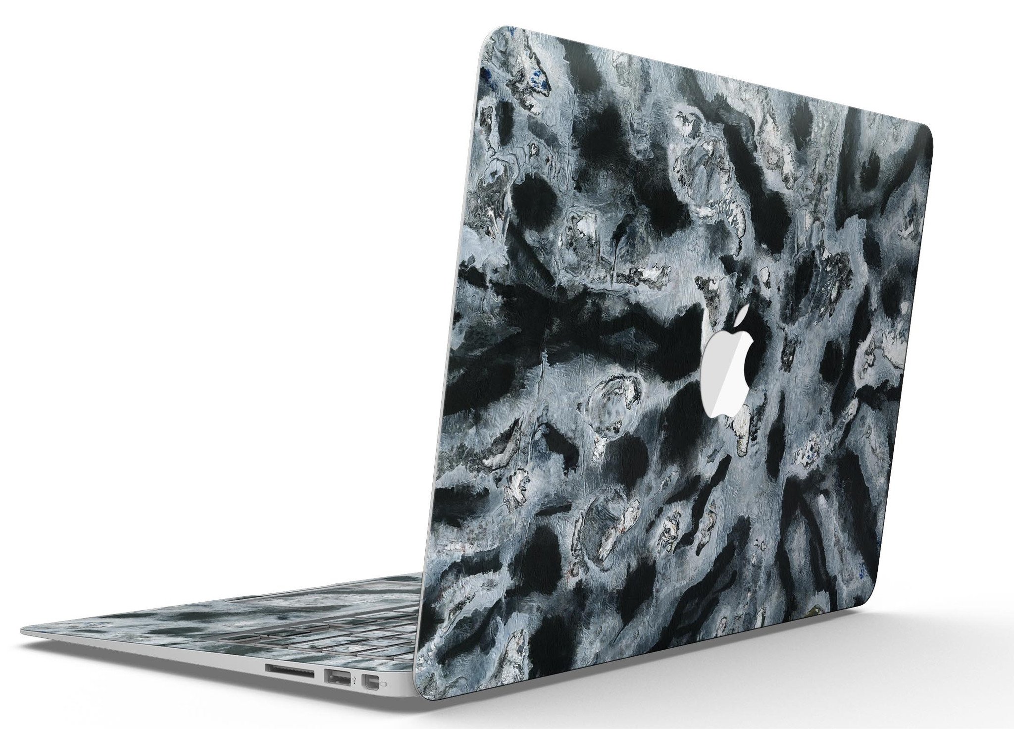 Abstract Paint v4 skin kit for MacBook Air, showcasing vibrant colors and unique design on a sleek device.