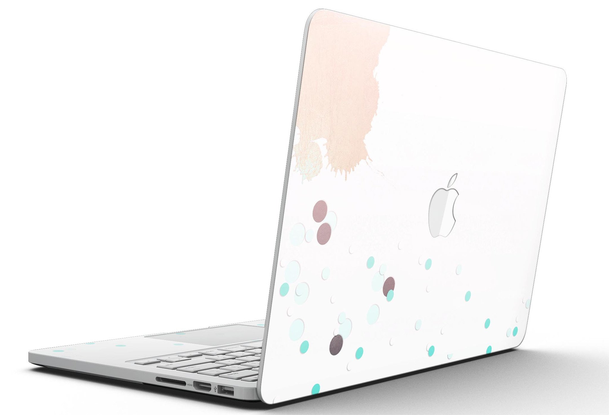 Stylish MacBook Pro skin featuring abstract teal dots and paint spill design, showcasing vibrant colors and a sleek finish.