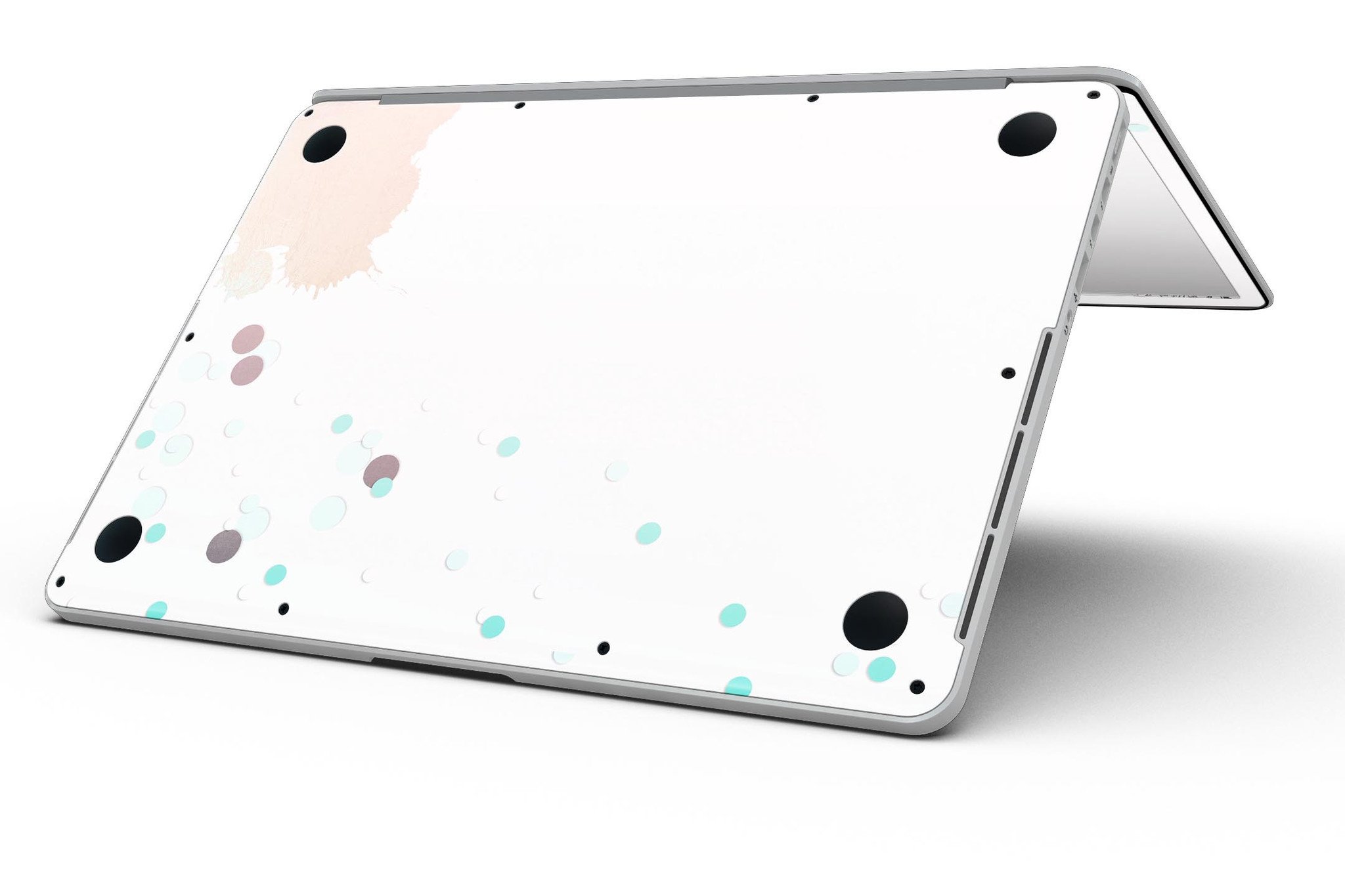 Stylish MacBook Pro skin featuring abstract teal dots and paint spill design, showcasing vibrant colors and a sleek finish.