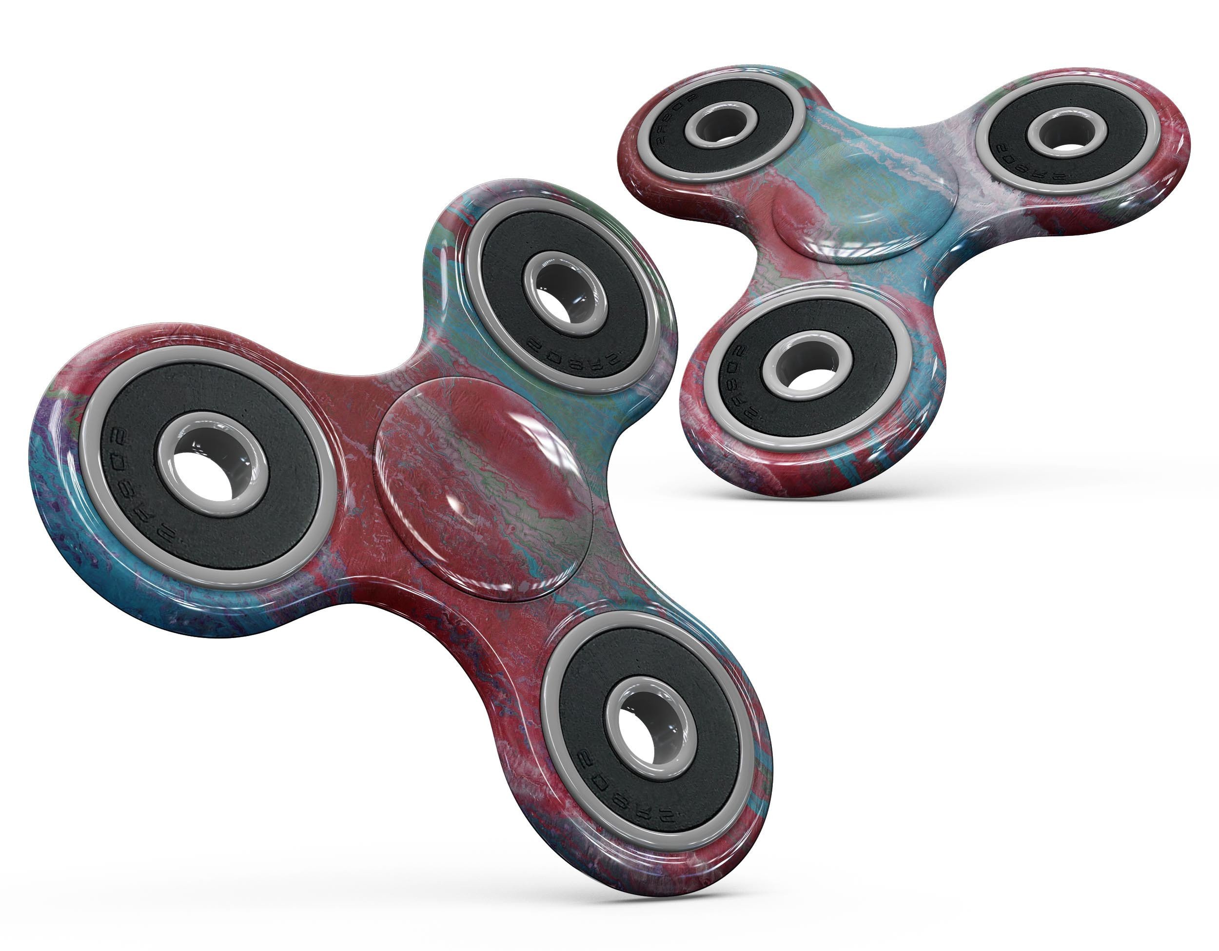 Abstract Wet Paint Red and Blue Full-Body Fidget Spinner Skin-Kit showcasing vibrant colors and a stylish design.