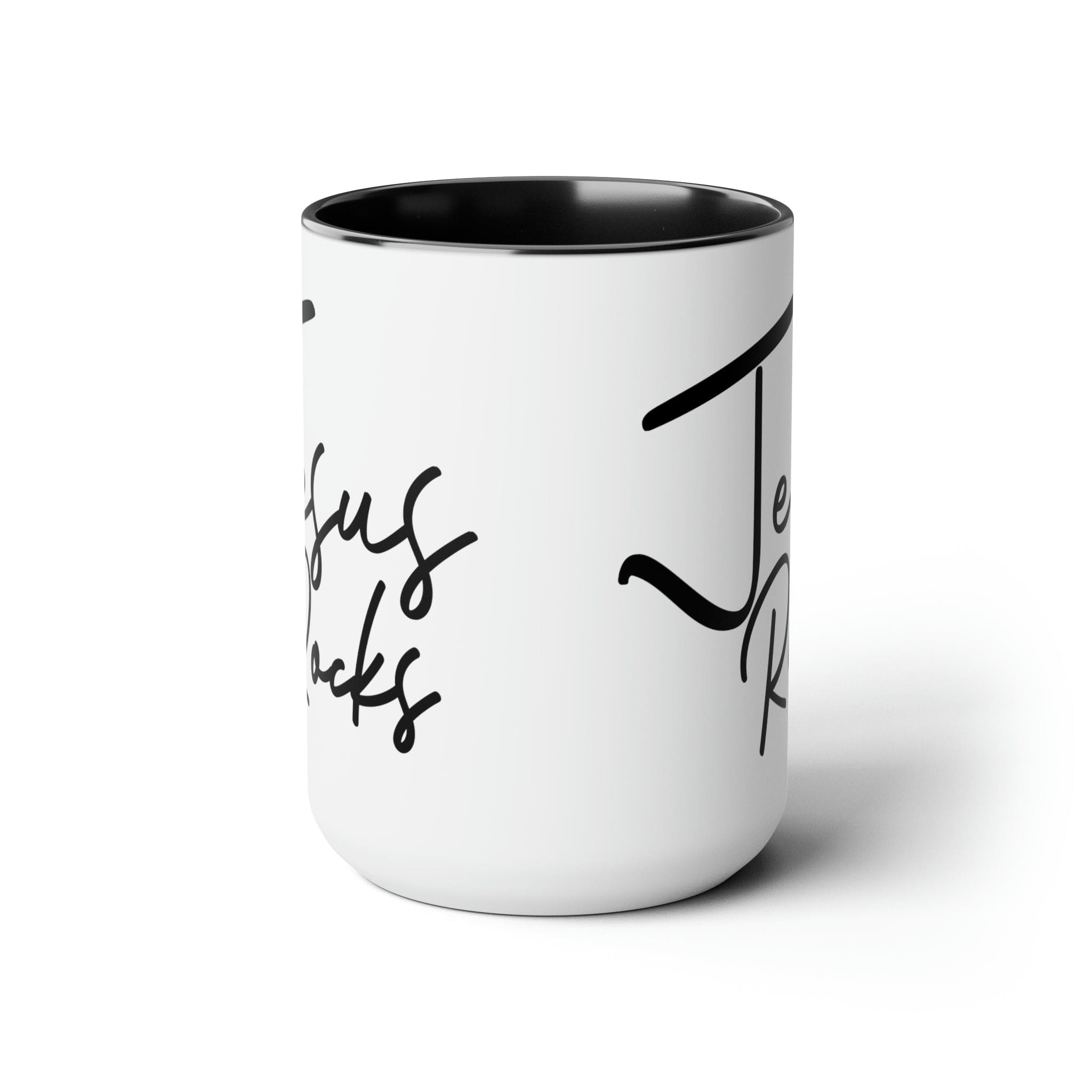 Black ceramic coffee mug with 'Jesus Rocks' text, featuring a colored interior and handle, perfect for hot and cold beverages.