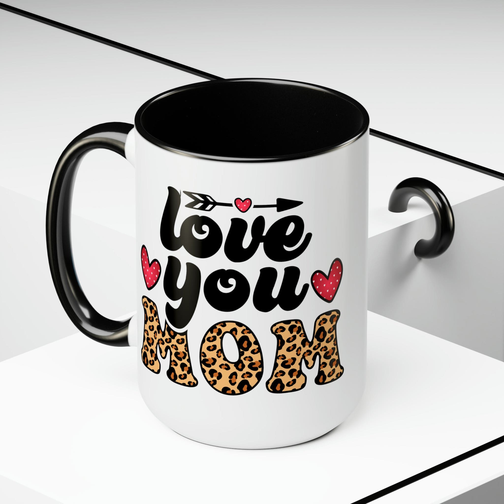 Accent Ceramic Coffee Mug featuring a Love You Mom leopard print design with a black exterior and colored interior, perfect for hot and cold beverages.