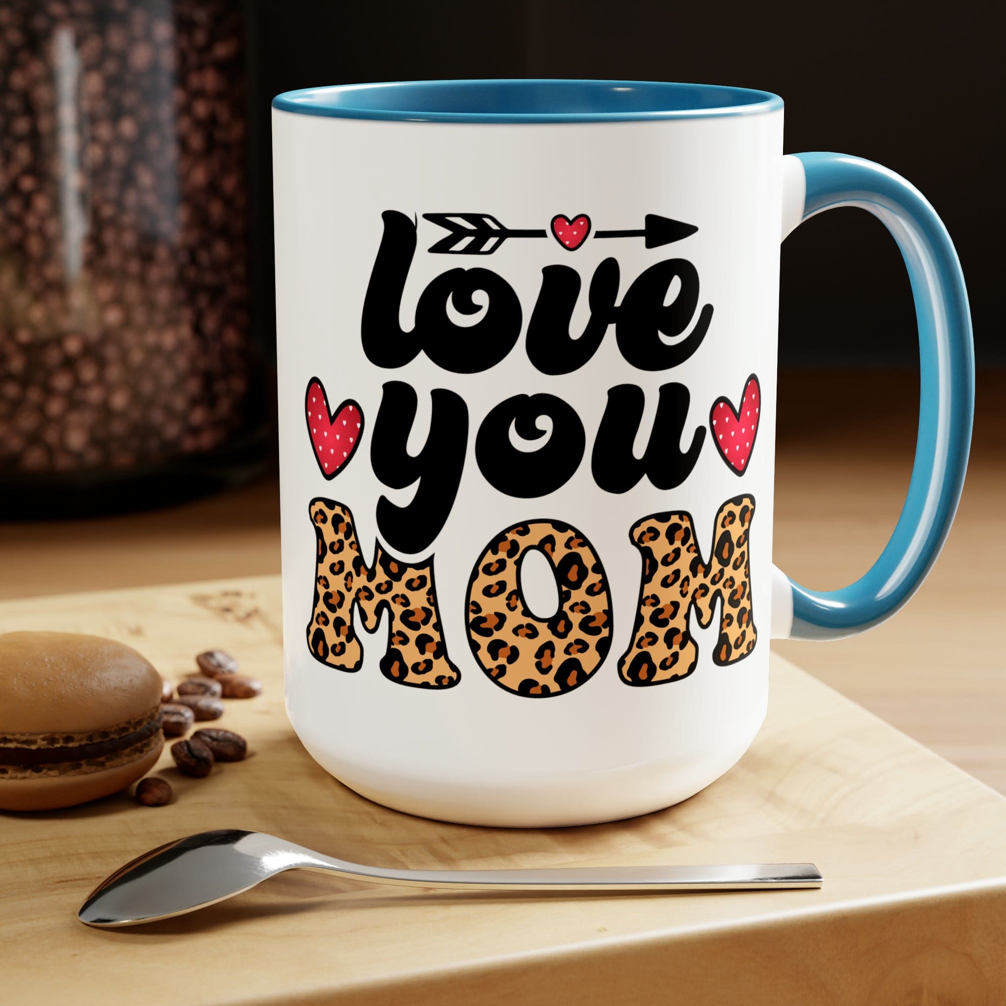 Accent Ceramic Coffee Mug featuring a Love You Mom leopard print design with a black exterior and colored interior, perfect for hot and cold beverages.