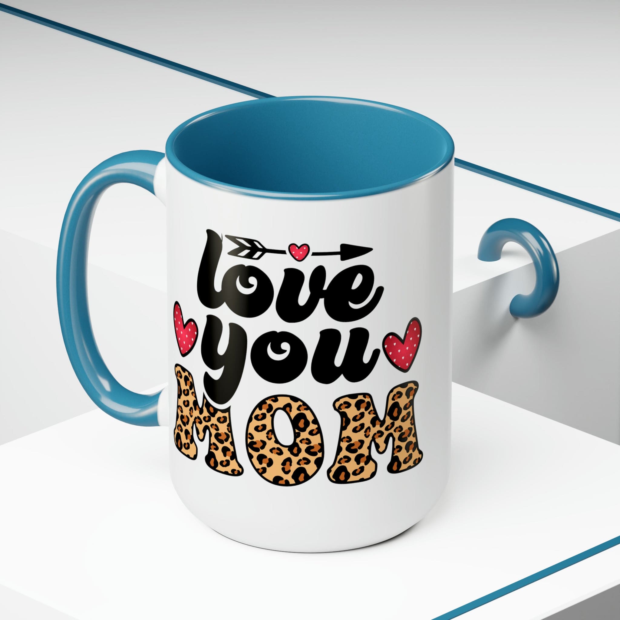 Accent Ceramic Coffee Mug featuring a Love You Mom leopard print design with a black exterior and colored interior, perfect for hot and cold beverages.