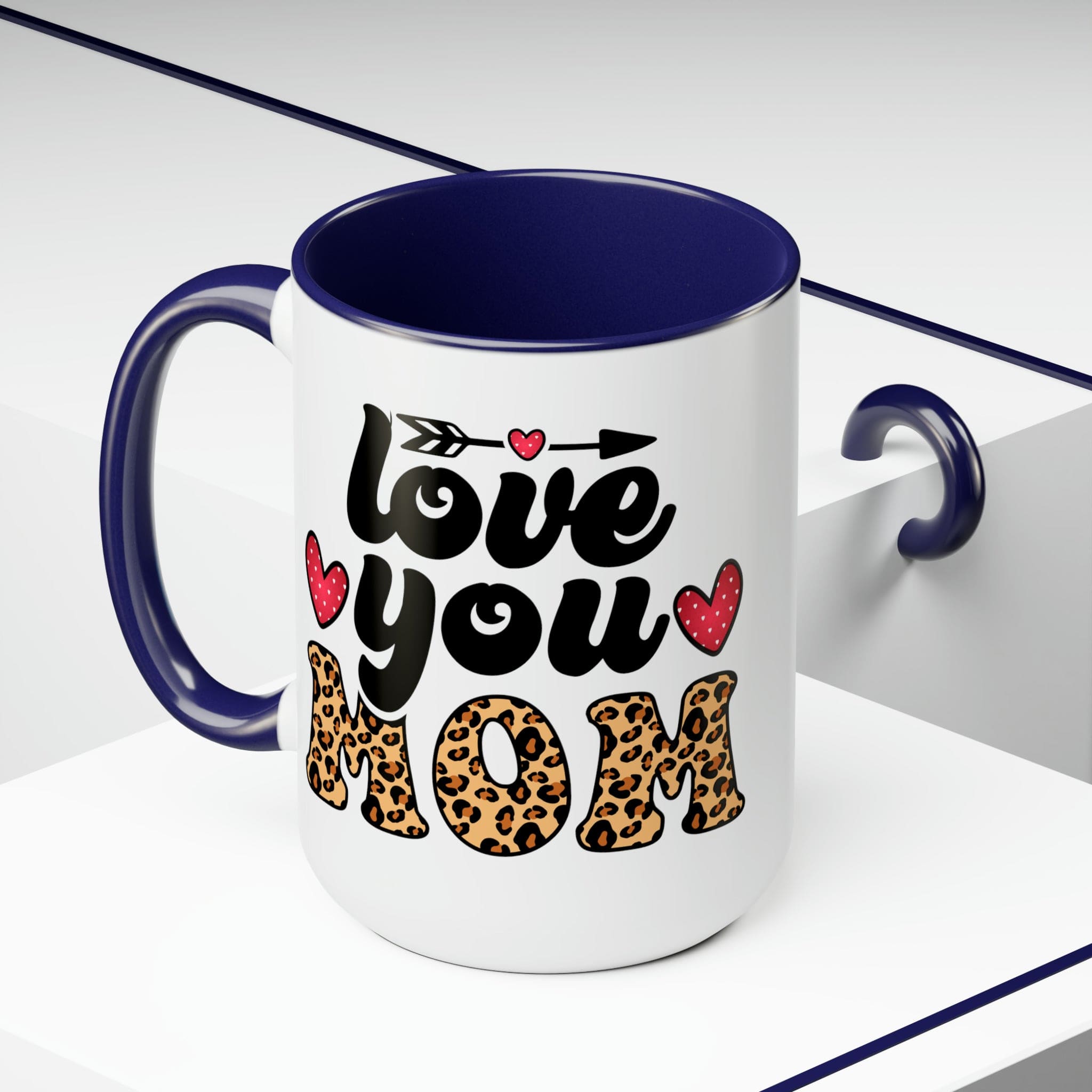 Accent Ceramic Coffee Mug featuring a Love You Mom leopard print design with a black exterior and colored interior, perfect for hot and cold beverages.