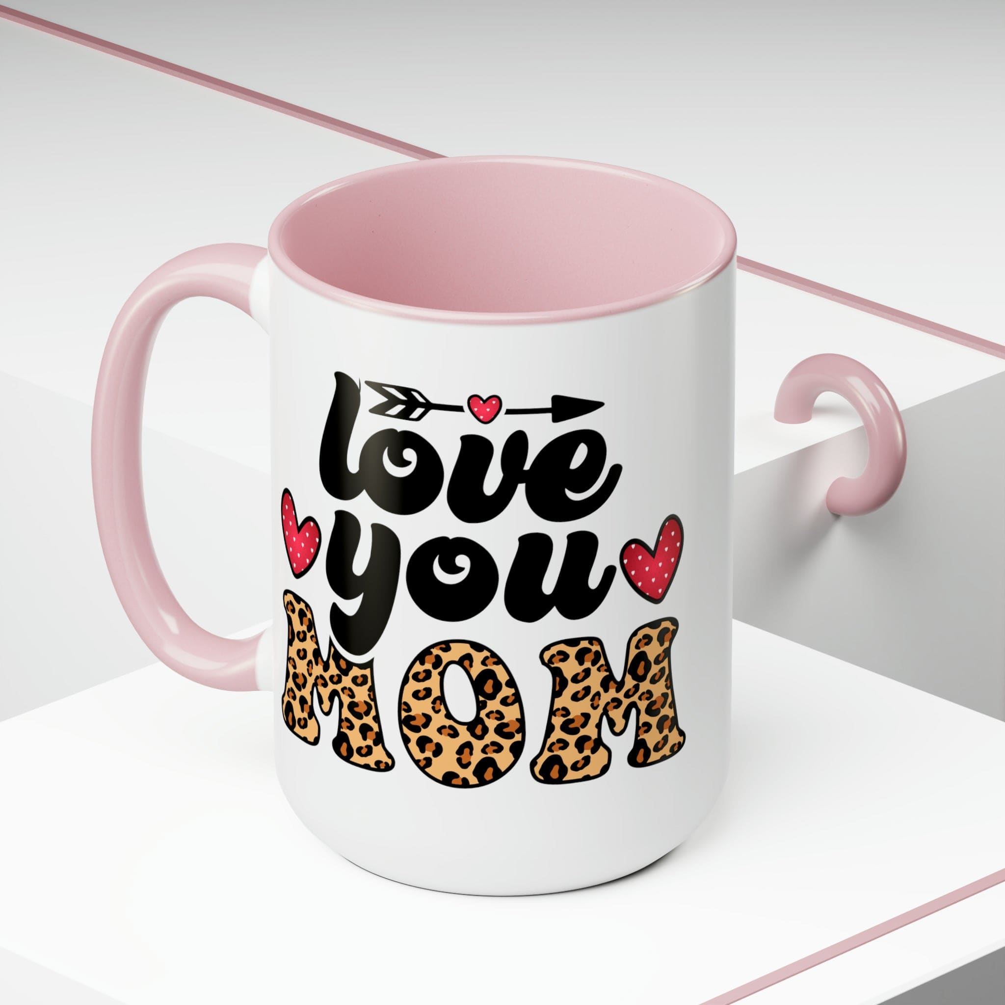 Accent Ceramic Coffee Mug featuring a Love You Mom leopard print design with a black exterior and colored interior, perfect for hot and cold beverages.