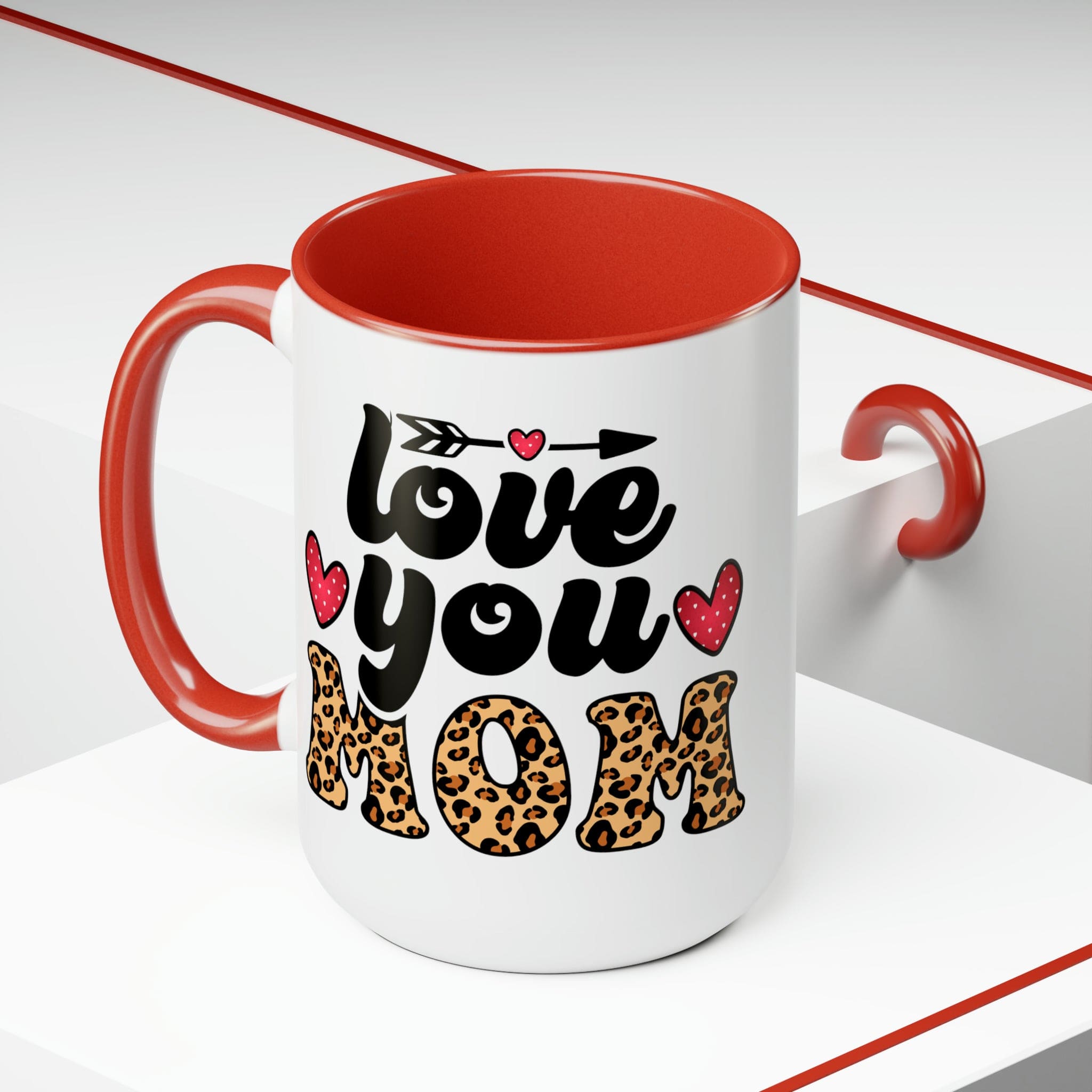 Accent Ceramic Coffee Mug featuring a Love You Mom leopard print design with a black exterior and colored interior, perfect for hot and cold beverages.