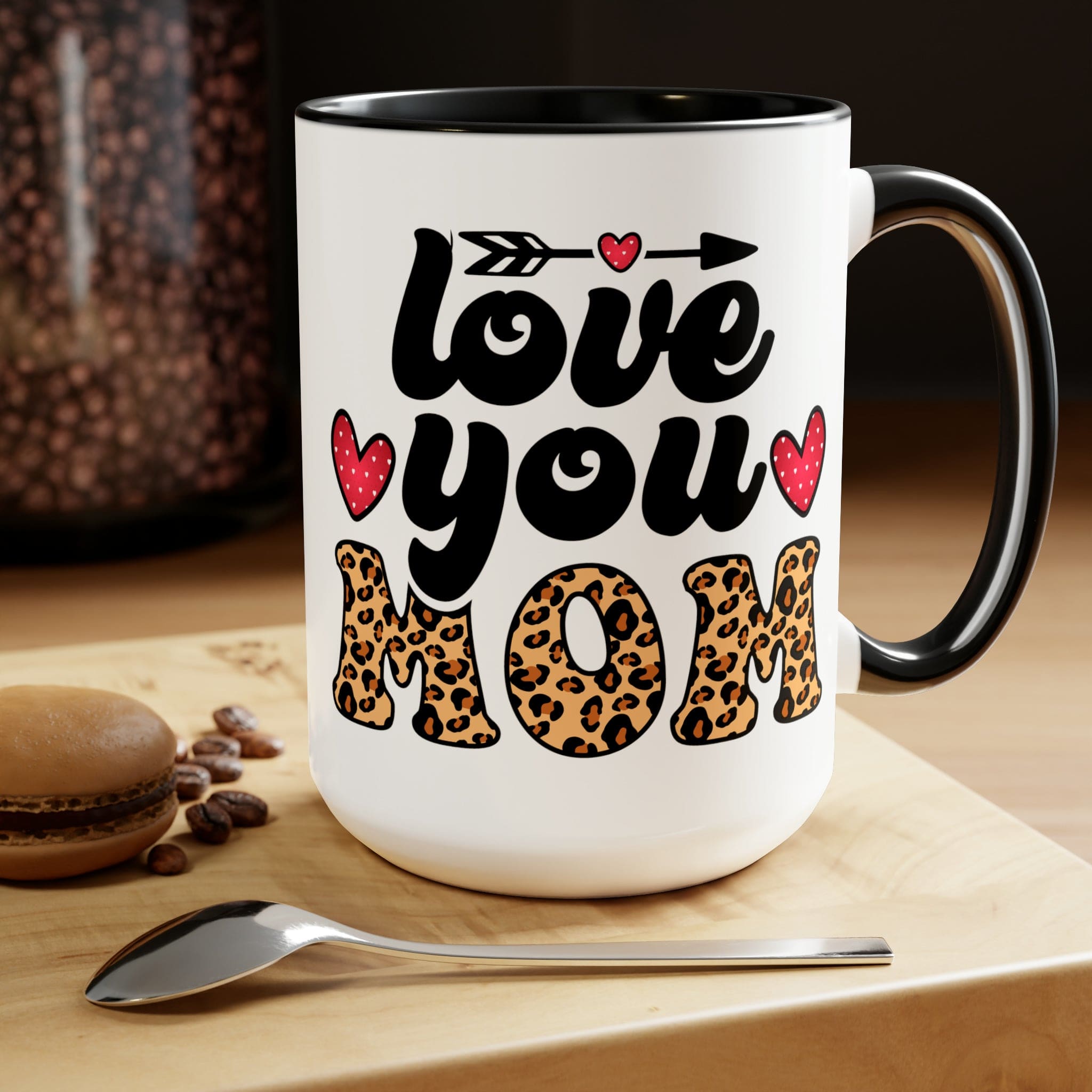 Accent Ceramic Coffee Mug featuring a Love You Mom leopard print design with a black exterior and colored interior, perfect for hot and cold beverages.