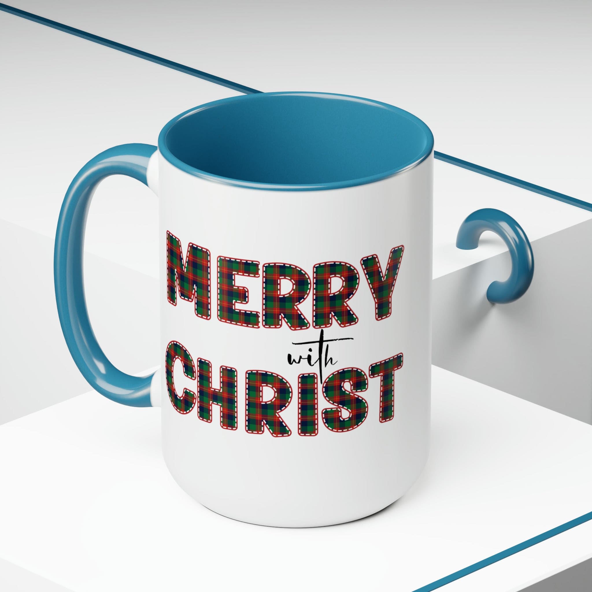 Accent Ceramic Coffee Mug 15oz featuring a Merry with Christ design in red and green plaid, perfect for holiday beverages.